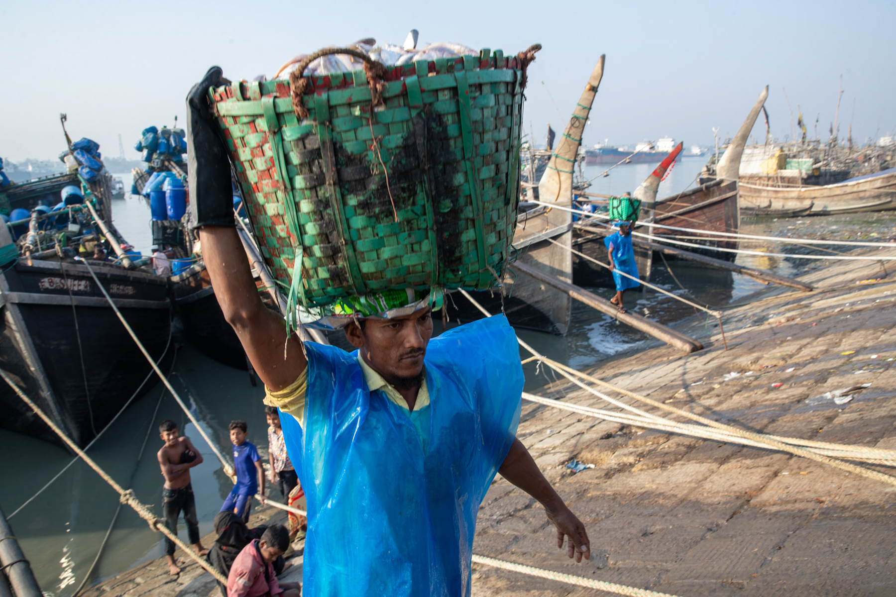 Offloading the fishing trawlers (image by Yousuf Tushar)