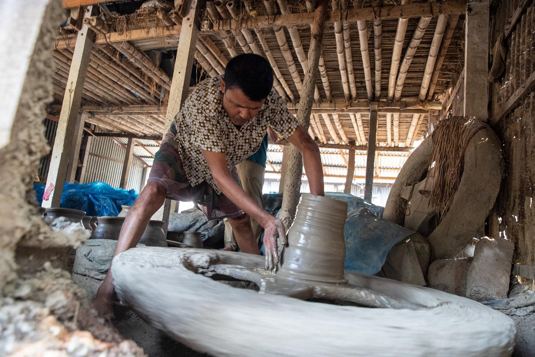Making pots and other clay vessels by hand (image by Yousuf Tushar)