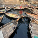 Every day, the city commuters of Dhaka cross the Buriganga in charismatic wooden boats. This is a typical 'taxi rank' (image by Yousuf Tushar)