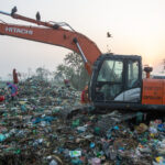 Waste workers in Sylhet are assisted by large machine diggers (image by Yousuf Tushar)