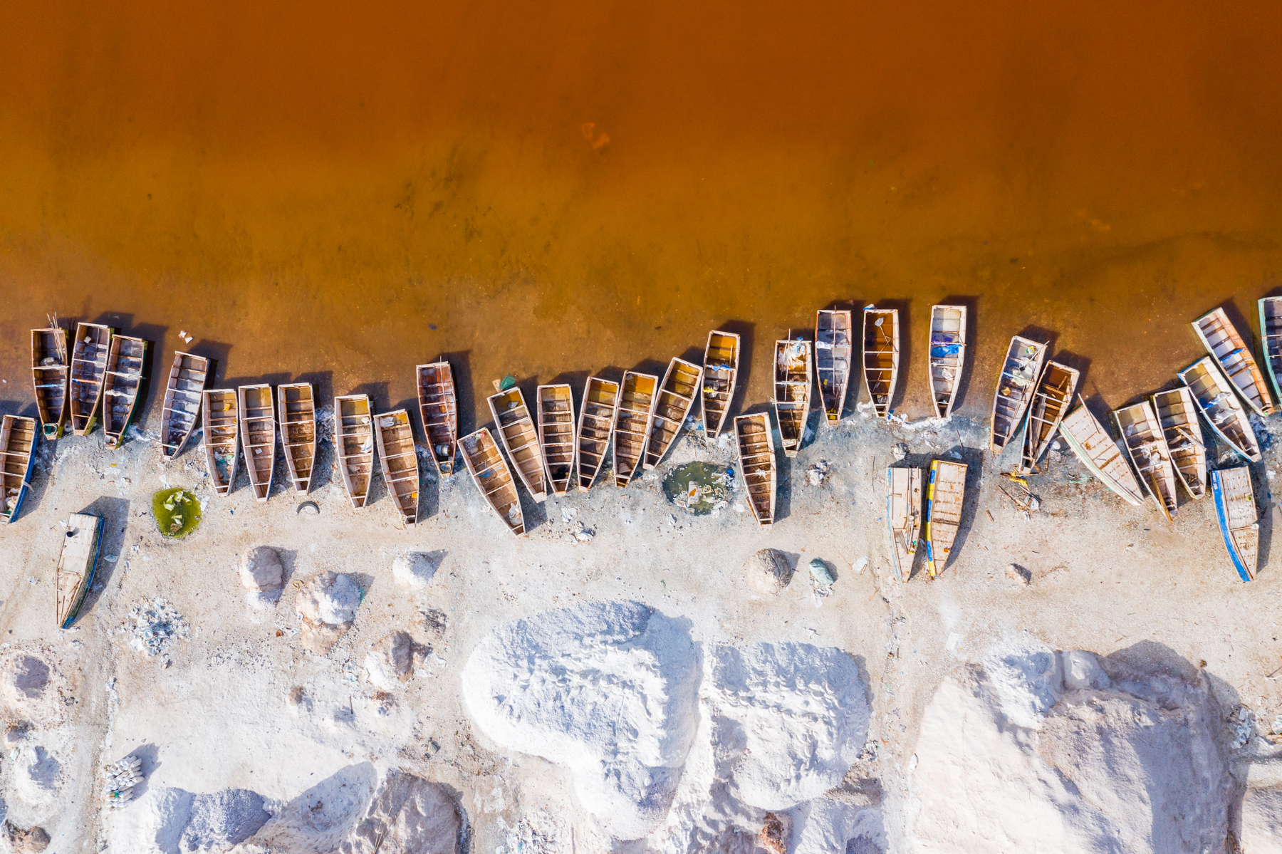 Salt boats line the shores of Lac Rose.