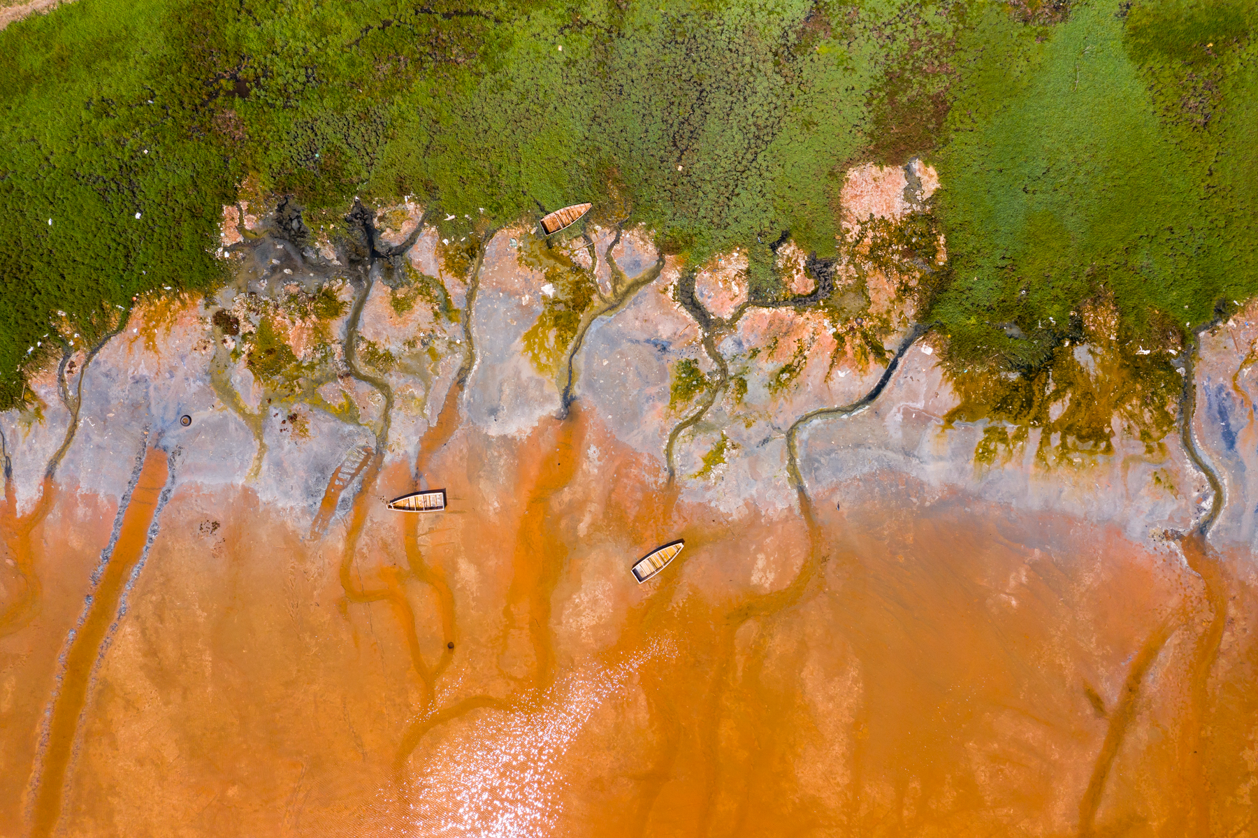 Life on the edge of Lac Rose, the pink salt lake of Senegal.