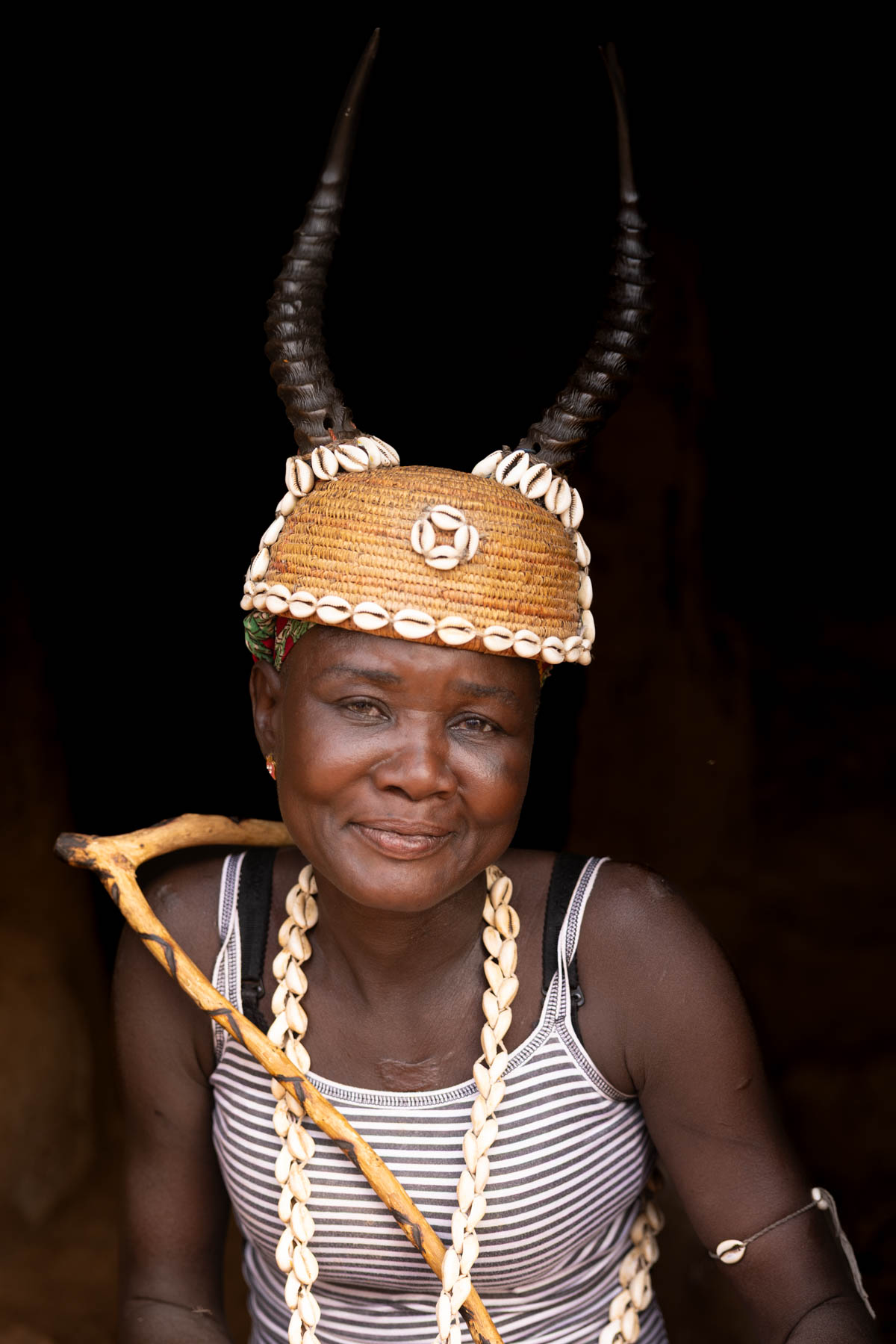 A gentle portrait of a Batammariba woman from Togo in ceremonial headwear: a cowrie-adorned hat with antelope horns (image by Ingrid Koedood)