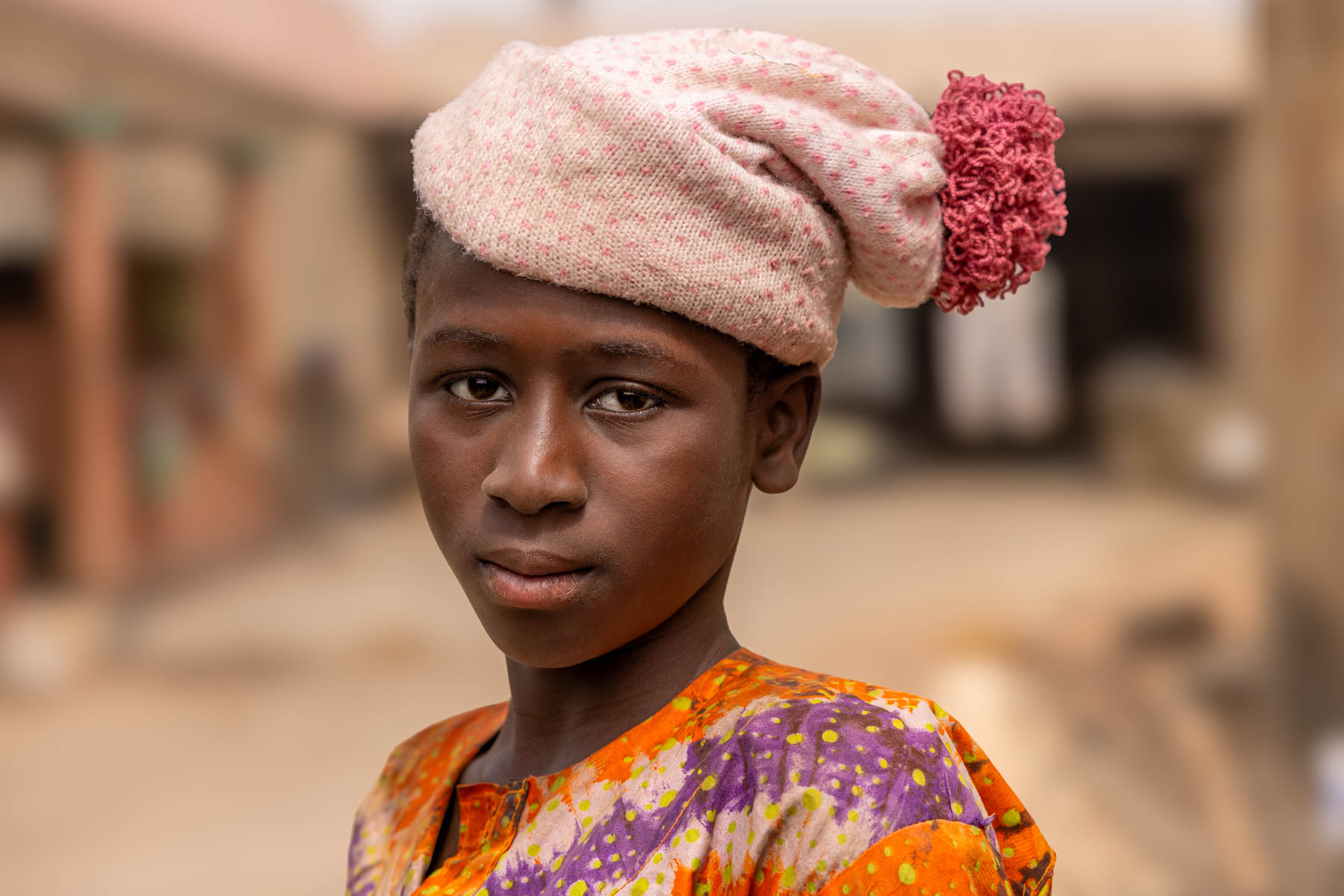 A young boy watching the Batonu horses dance, wrapped in his own style, even in the heat (image by Ingrid Koedood)