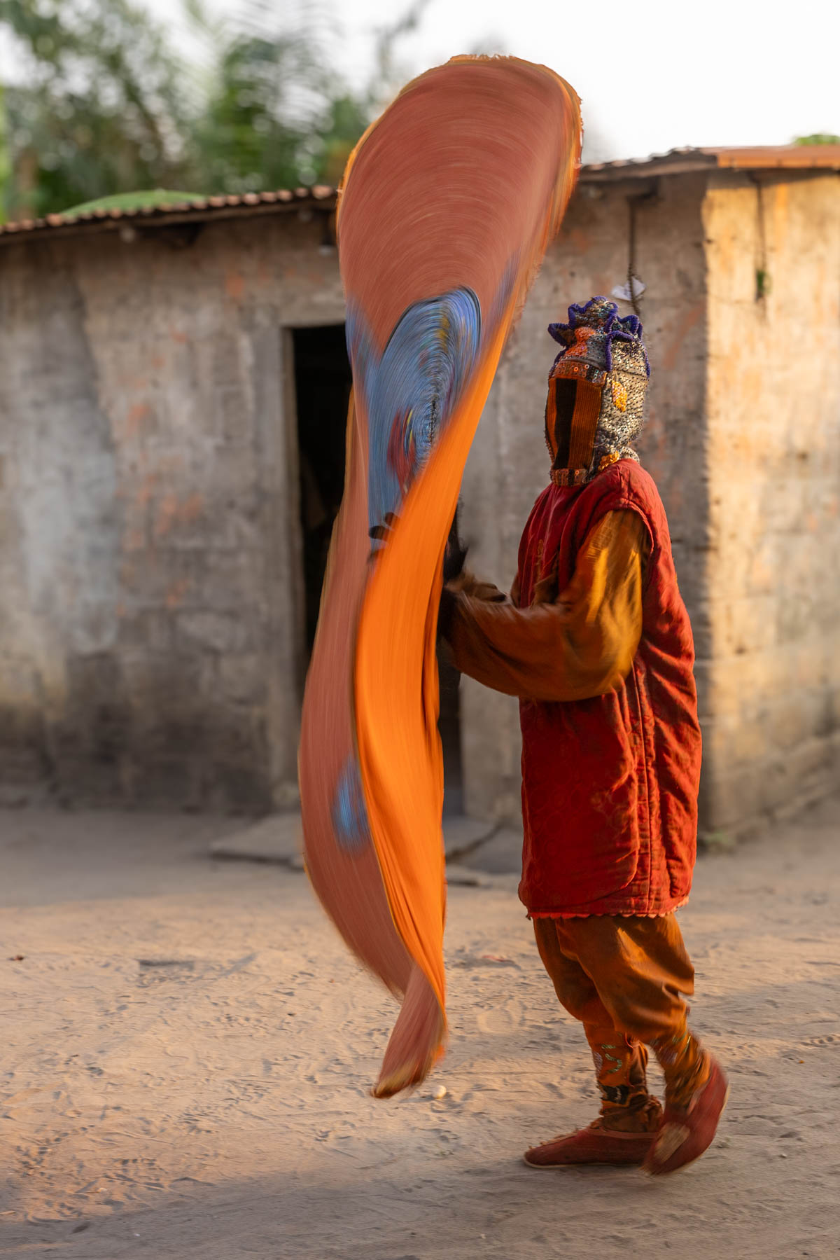 Egungun ceremony, spinning in circles as the costume becomes a living swirl of color (image by Ingrid Koedood)