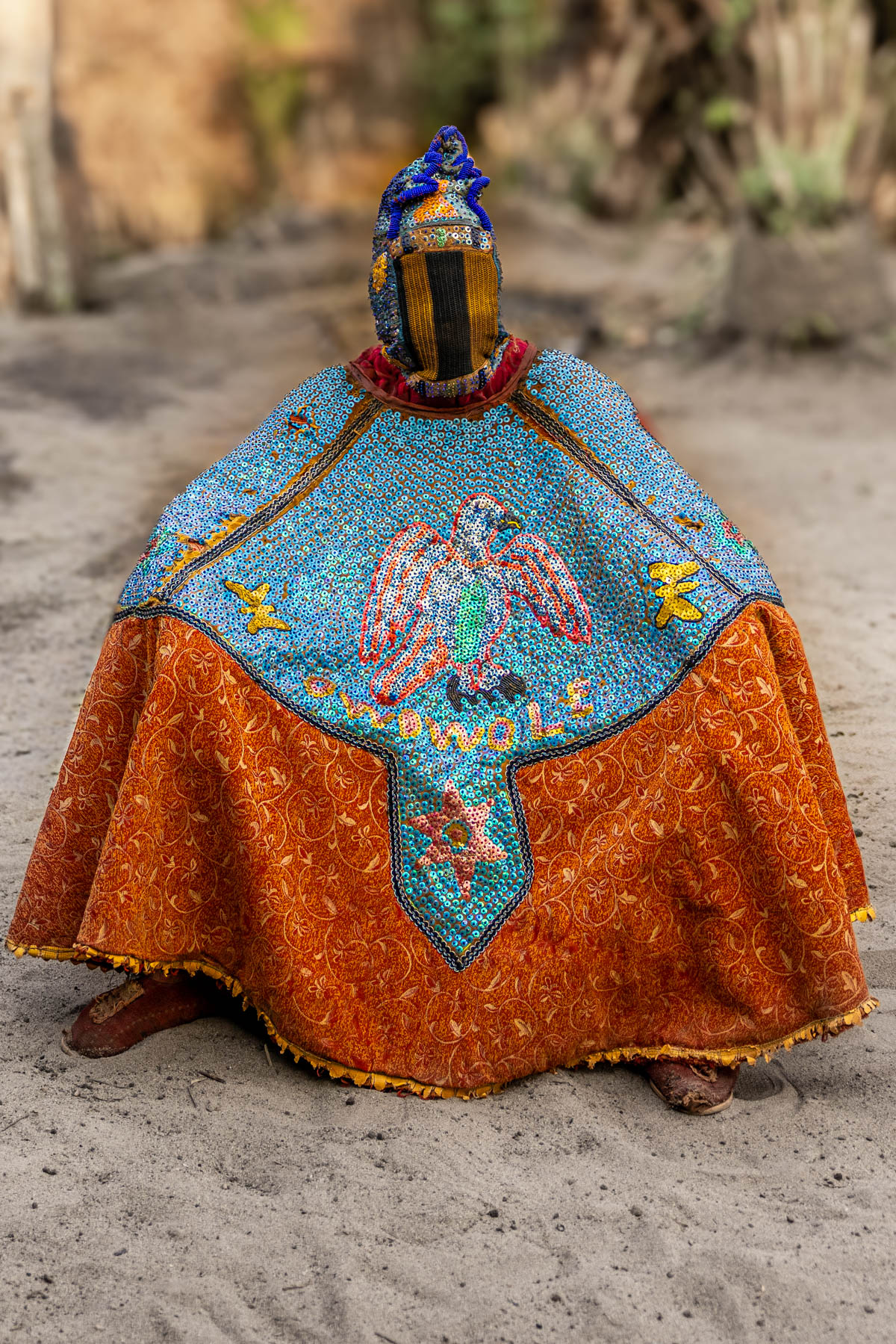 Egungun dancer covered in an elaborate costume of heavy fabrics and embroidery. The dancer becomes the visible form of an ancestor spirit (image by Ingrid Koedood)
