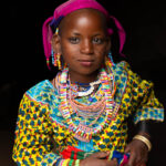 A young Fulani girl dressed in vibrant traditional clothing. Tradition in full colour (image by Ingrid Koedood)