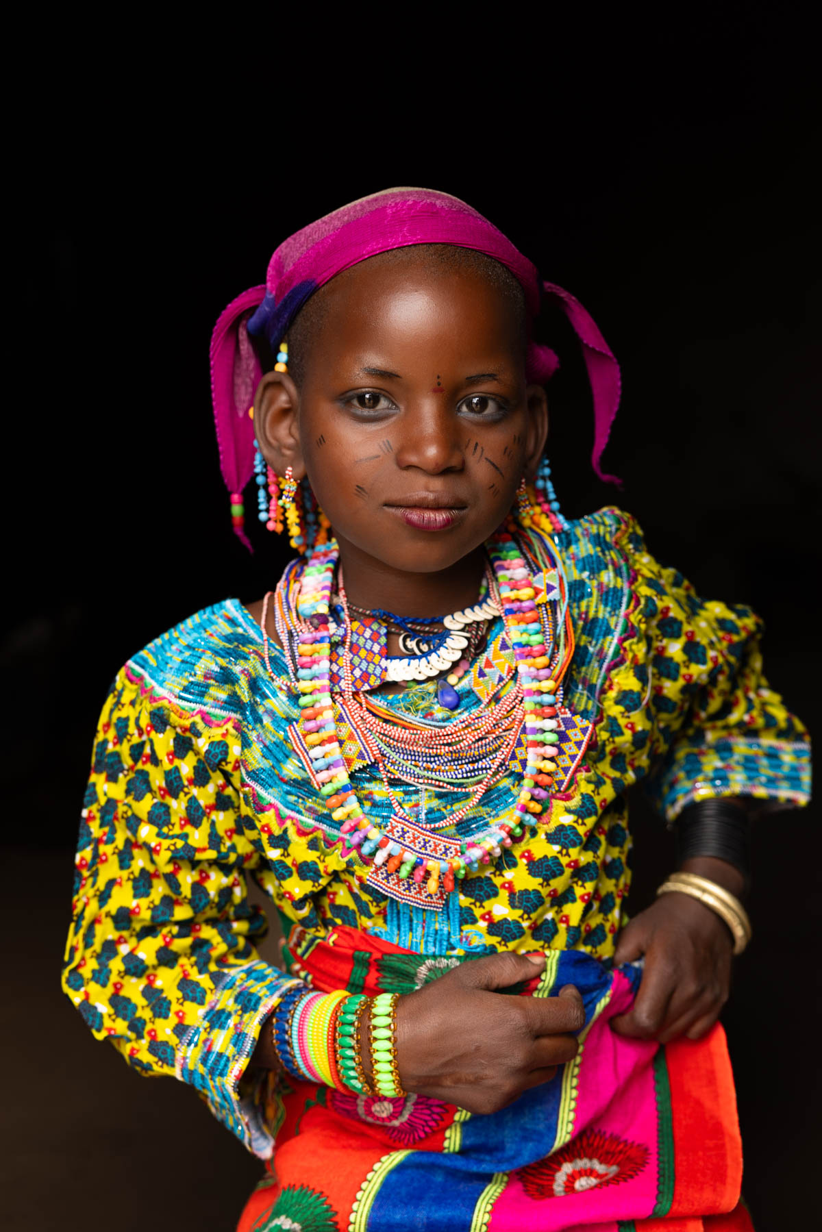 A young Fulani girl dressed in vibrant traditional clothing. Tradition in full colour (image by Ingrid Koedood)