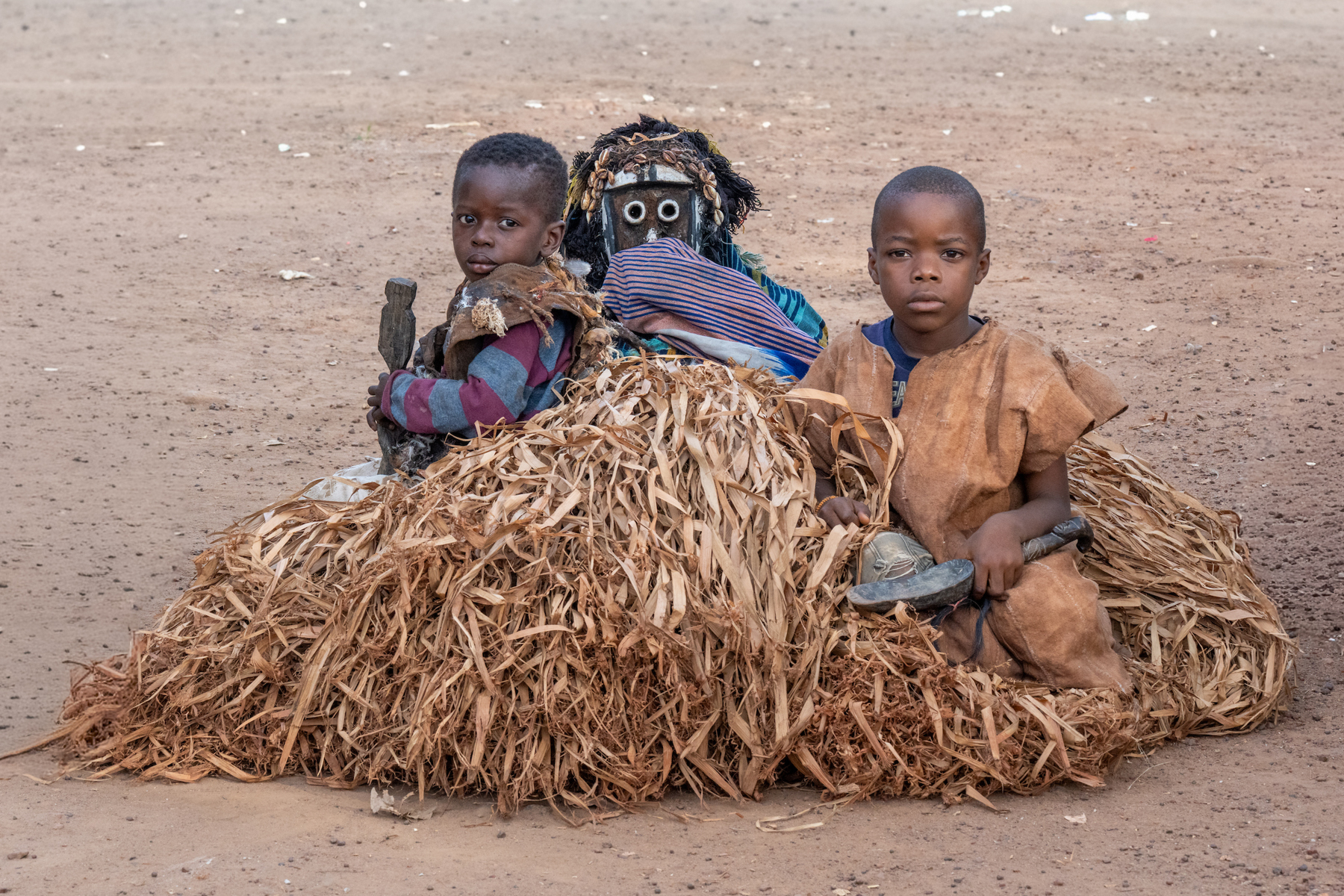 Gba masked dancer with young initiate boys (image by Inger Vandyke)
