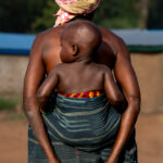 Safe in Grandma's Embrace - Godoufouma Village (Image by Craig Baulcomb)