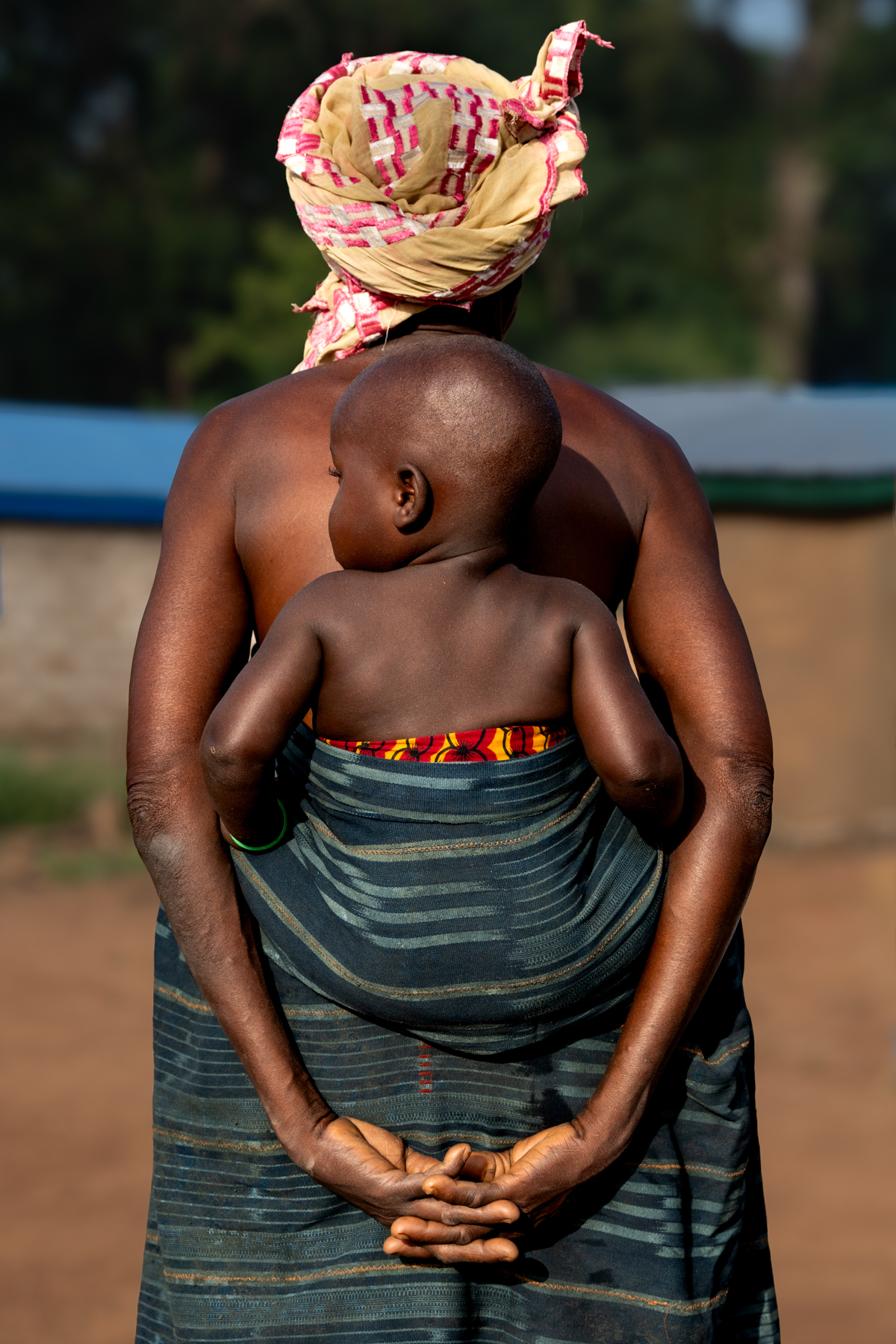 Safe in Grandma's Embrace - Godoufouma Village (Image by Craig Baulcomb)