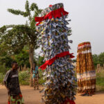 During the Gounouko mask ceremony a guardian keeps watch over the sacred masks (image by Ingrid Koedood)