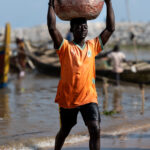 Bringing in the Catch - Grand Bassam (Image by Craig Baulcomb)