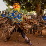 A whirlwind of raffia and colour during the Guèlèdè masquerade (image by Ingrid Koedood)