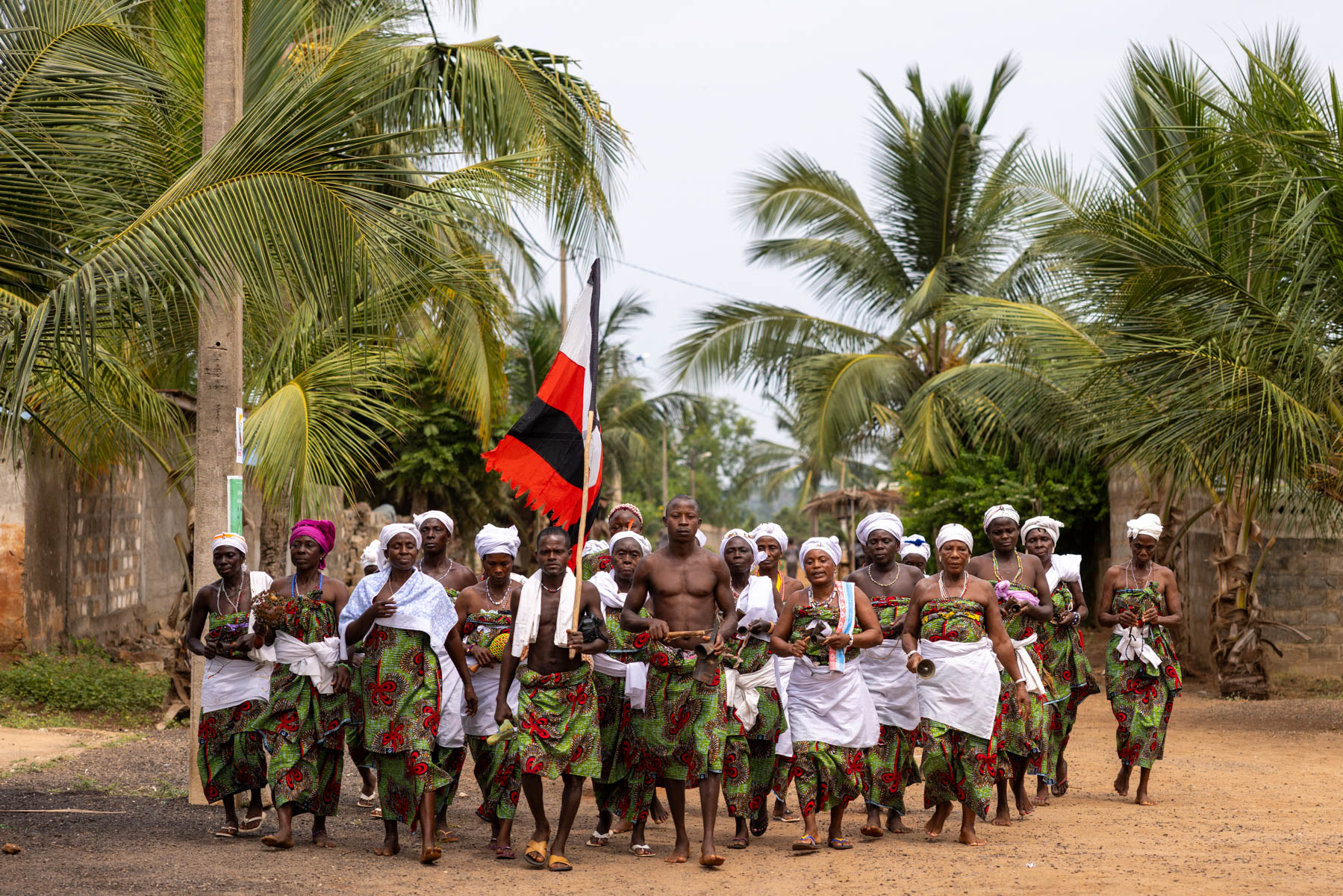 By chance we encountered a Heviosso ceremony. The community was on his way, and we were warmly invited to join (image by Ingrid Koedood)
