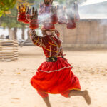 A Heviosso devotee running with a flaming headpiece during the fire ceremony (image by Ingrid Koedood)