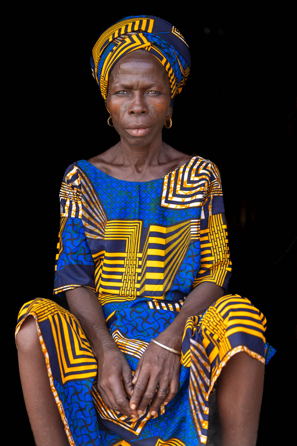 Portrait of beautiful woman of the Holi tribe with traditional scarification on her face (image by Ingrid Koedood)