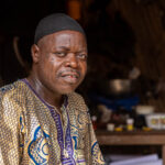 Portrait of a Holi man in front of his house with traditional scarification in his face (image by Ingrid Koedood)