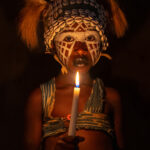 Jongleur girl with candle (image by Inger Vandyke)