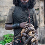 Malinke man with carvings (image by Inger Vandyke)