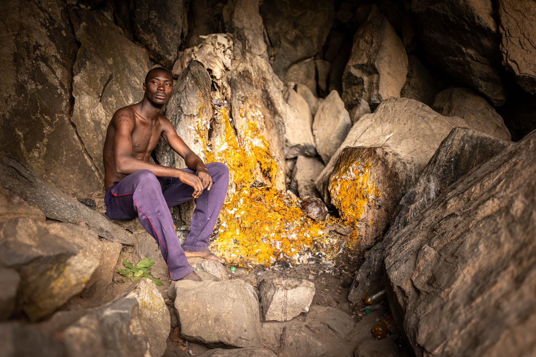 Inside a Sakpata shrine. A hidden sacred space within a rocky cave where prayers for protection and healing are offered (image by Ingrid Koedood)