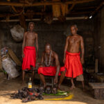 Red cloth, sacred objects, and focused hands: the Shango priests prepare for Shango’s arrival (image by Ingrid Koedood)