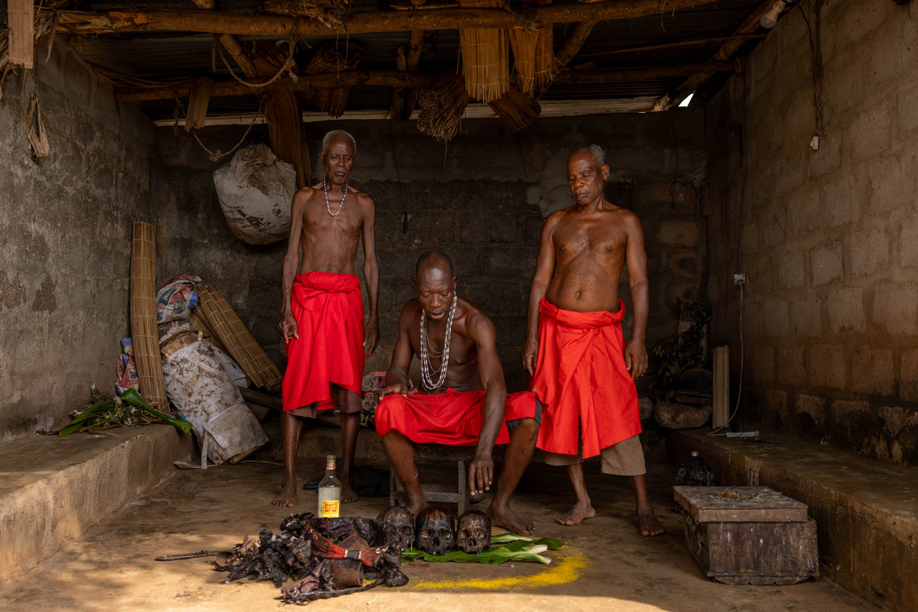 Red cloth, sacred objects, and focused hands: the Shango priests prepare for Shango’s arrival (image by Ingrid Koedood)