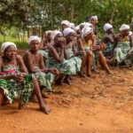 During the annual Vodun Days in Benin, people gather outside the palace of King Agassa, waiting for the ceremonies to begin (image by Ingrid Koedood)