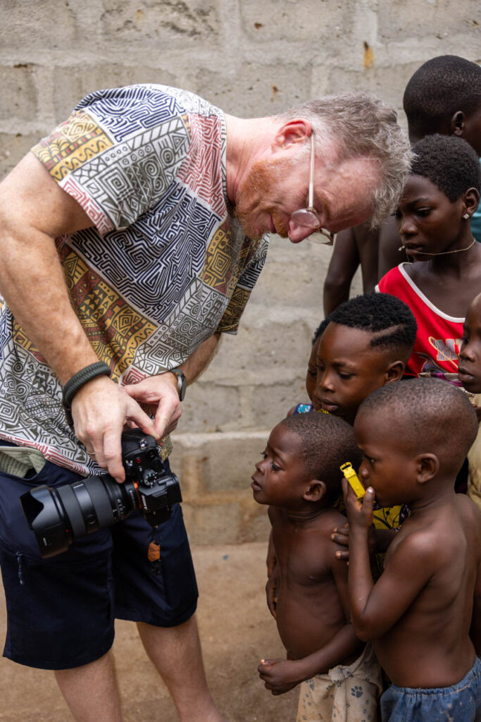 Moments like this are why we travel. Guenter sharing stories through his lens (image by Ingrid Koedood)