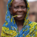 Portrait of a woman watching the Zangbeto ceremony (image by Ingrid Koedood)