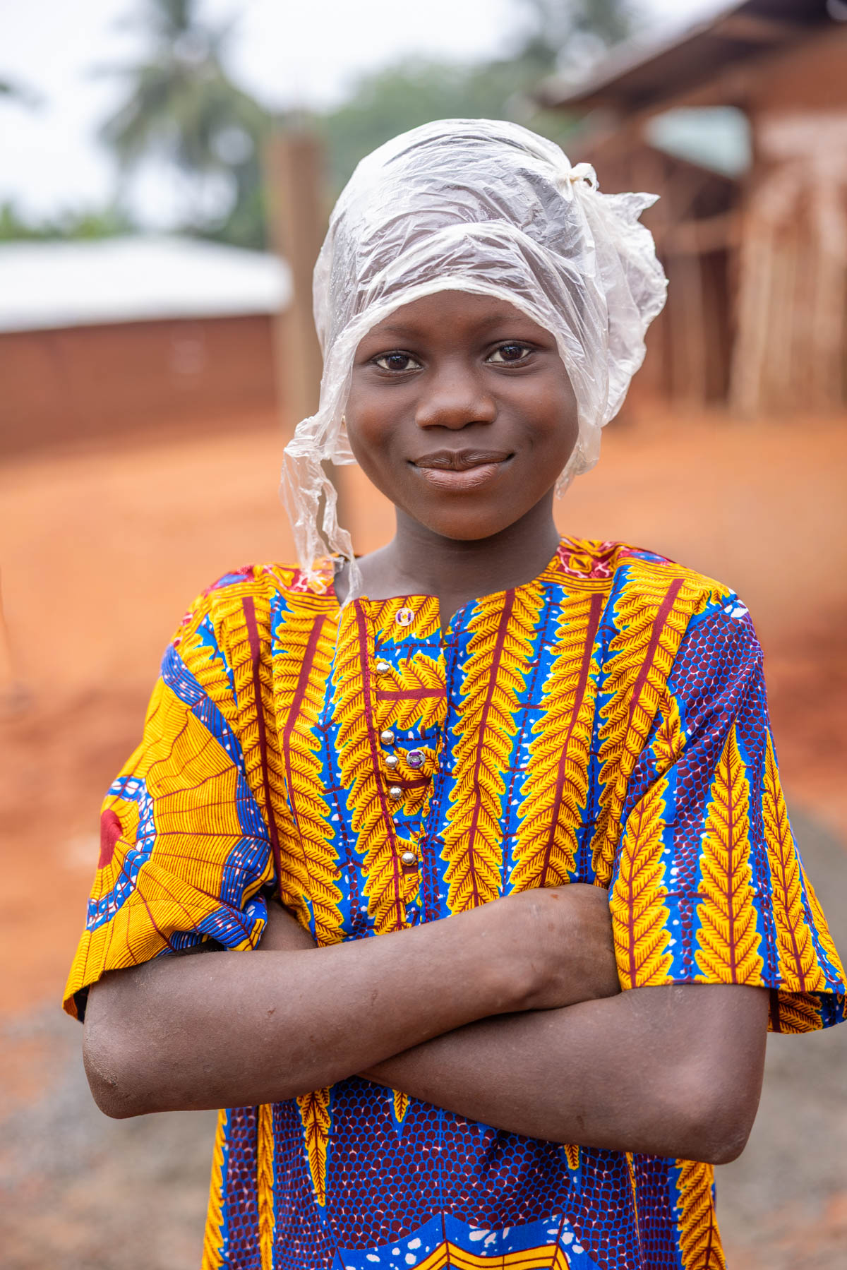 On our way to the Zangbeto ceremony we got caught in heavy rain. This girl came prepared (image by Ingrid Koedood)