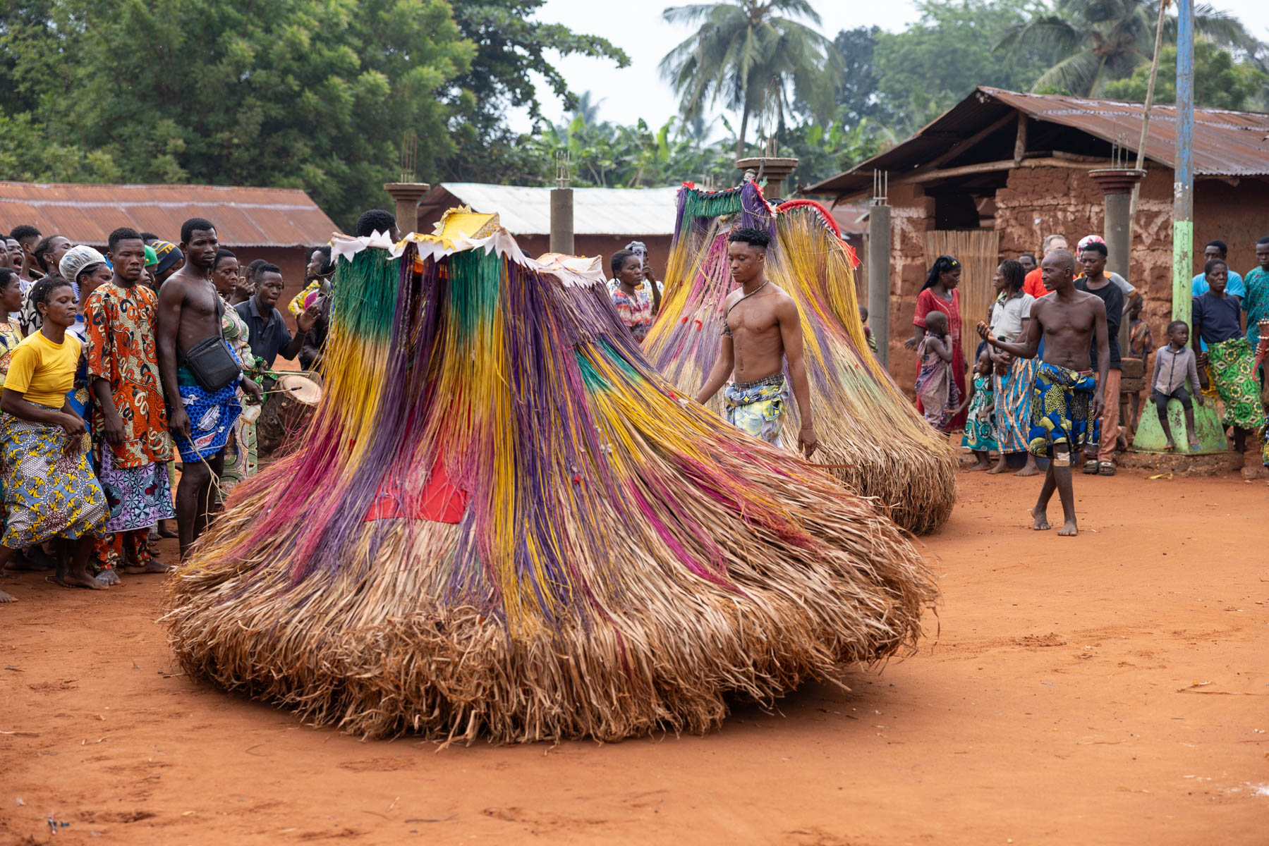 Zangbeto: the night guardians. The spirit figure spins in circles, guided and protected by a guard as it moves through the crowd (image by Ingrid Koedood)