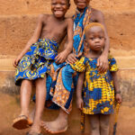 Between the rituals and the drums of a Zangbeto ceremony, the children asked to be photographed (image by Ingrid Koedood)
