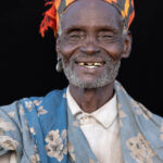 An Arbore elder who was eager to be photographed, offering a warm smile shaped by a lifetime of stories. (image by Ingrid Koedood)