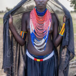 Gido, a well-known Arbore woman, often photographed for her striking presence. Among the Arbore, women traditionally shave their heads. (image by Ingrid Koedood)
