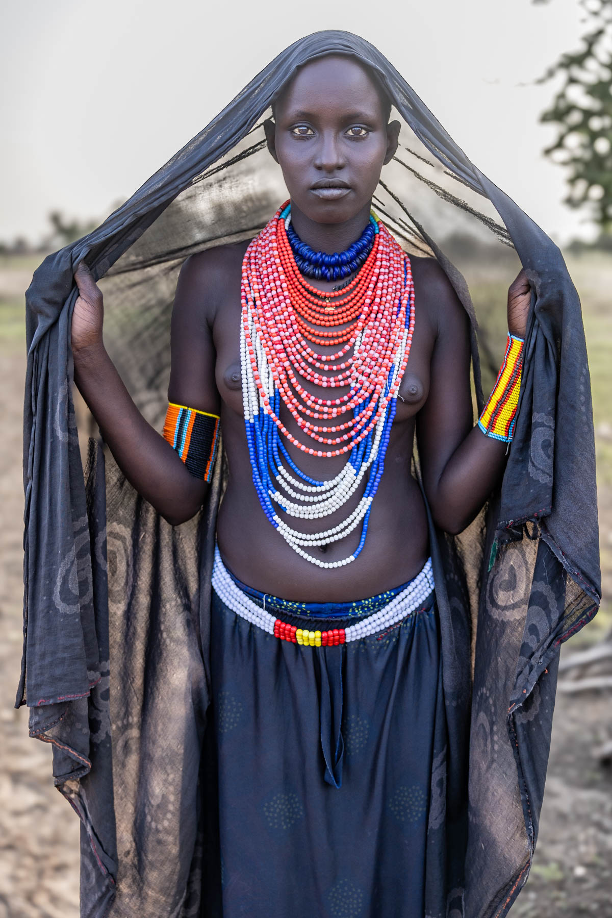 Gido, a well-known Arbore woman, often photographed for her striking presence. Among the Arbore, women traditionally shave their heads. (image by Ingrid Koedood)