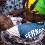 A gentle smile in the middle of the vibrant Ari market. (image by Ingrid Koedood)