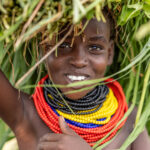 On the way to the Dassanech tribe, we saw many people carrying fresh grass after the rains. (image by Ingrid Koedood)