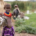 Dassanech girl proudly showing today’s catch. (image by Ingrid Koedood)