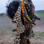 Ostrich headdresses, leopard skin and ankle bells: part of a man’s attire during the Dimi ceremony. (image by Ingrid Koedood)