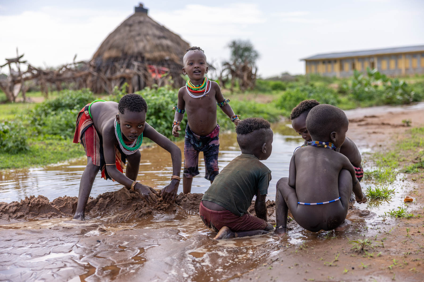 After the rain, the Hamar children play freely in water and mud. (image by Ingrid Koedood)