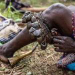 Close up of a woman who is preparing herself for the bull jumping ceremony (image by Ingrid Koedood)