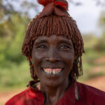 This Hamar woman gave the camera a big smile. (image by Ingrid Koedood)