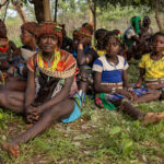 The Hamar people were waiting in the shade during the bull jumping ceremony. (image by Ingrid Koedood)