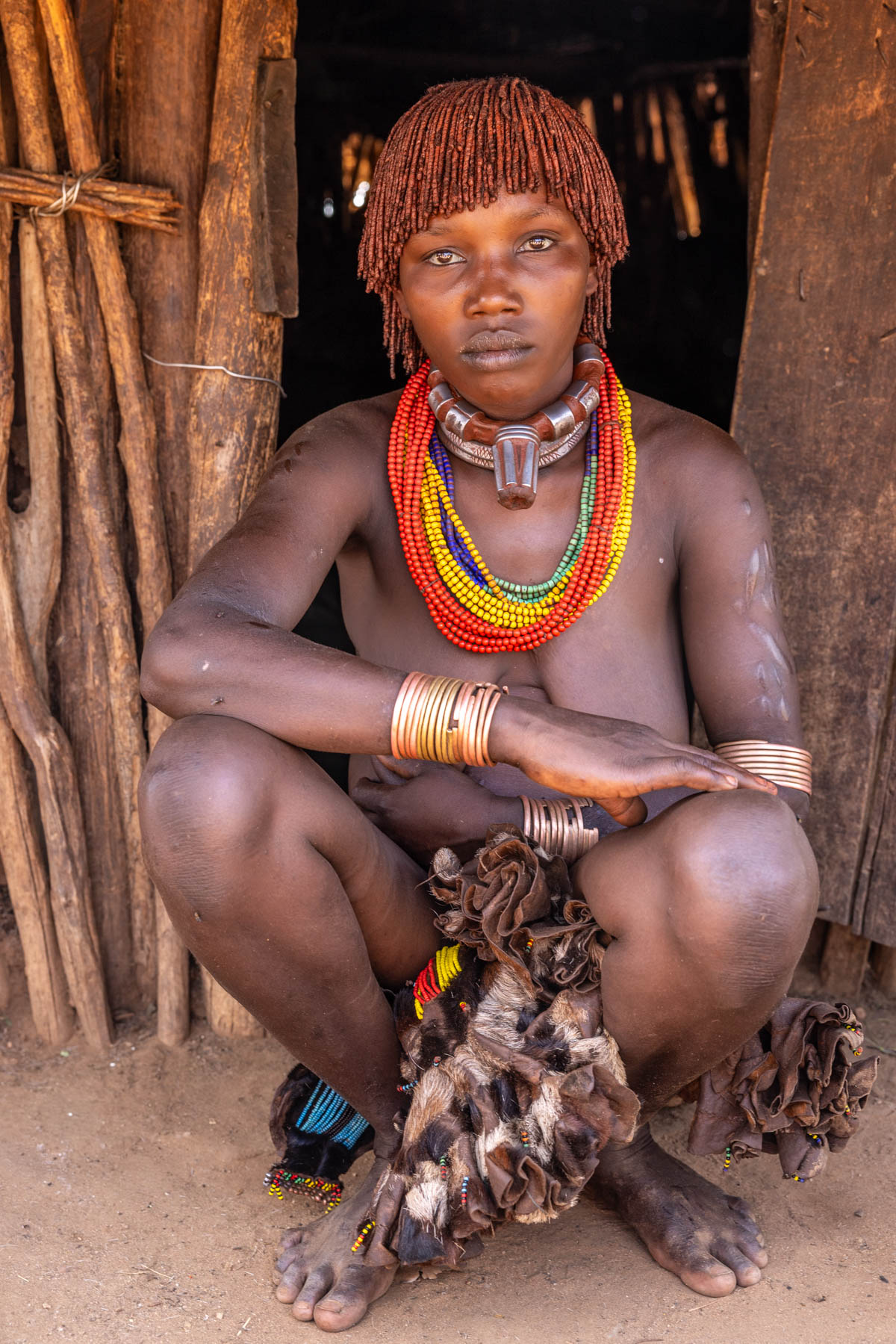 Hamar woman sitting in front of her hut. (image by Ingrid Koedood)