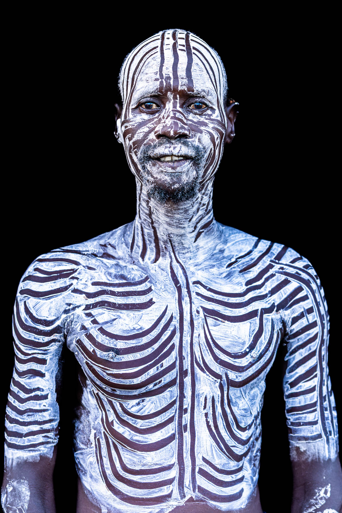 Kara man with painted face and body. (image by Ingrid Koedood)