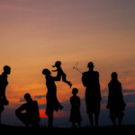 Silhouettes of the Kara people, held in the last light of day. (image by Ingrid Koedood)