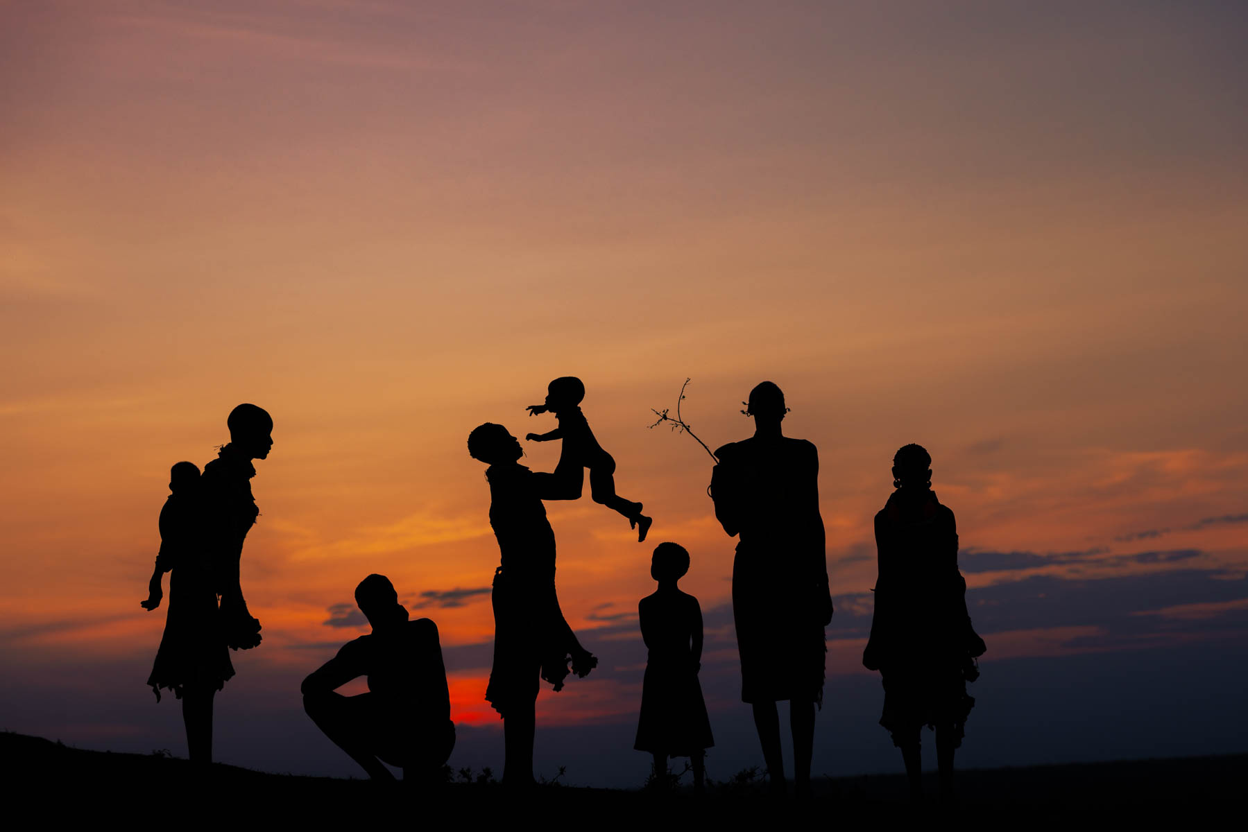 Silhouettes of the Kara people, held in the last light of day. (image by Ingrid Koedood)