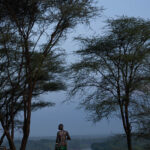 Mornings breaks over the Omo river, where a Kara man stands in silence. (image by Ingrid Koedood)