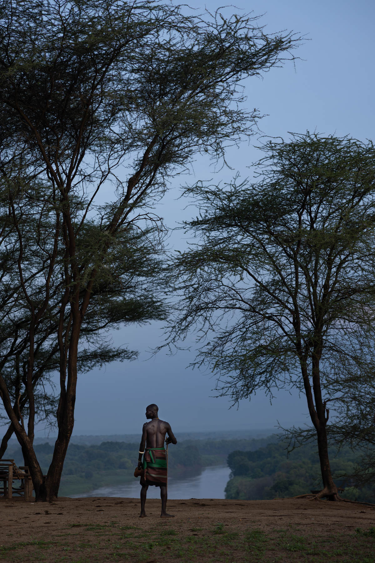Mornings breaks over the Omo river, where a Kara man stands in silence. (image by Ingrid Koedood)
